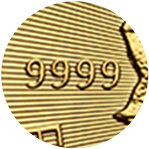 Close up of gold coin showing mark of 99.99% pure gold, 9999. Close up of gold coin showing mark of 99.99% pure gold, 9999.
