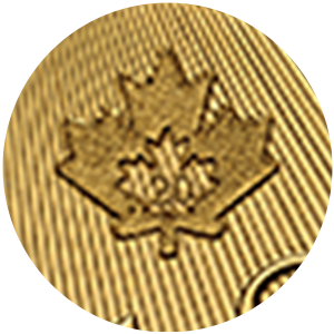 Close up of gold coin, privy mark of a maple leaf. Close up of gold coin, privy mark of a maple leaf.
